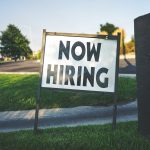 sign saying 'now hiring'